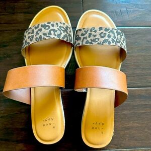 Tan and leopard flip flops